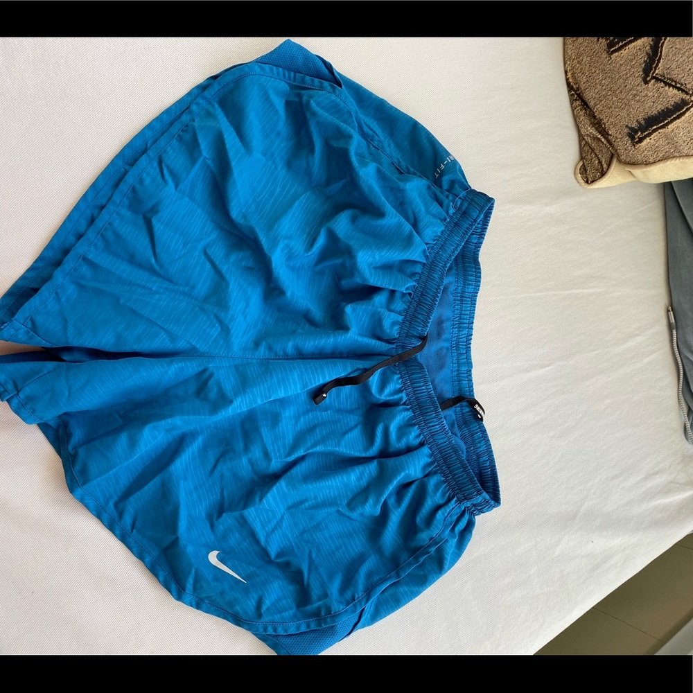 Blue nike running shorts